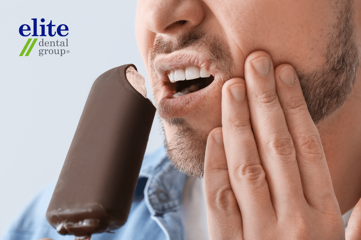 Man having sensitive teeth when eating cold foods | Root Canal Treatment